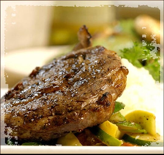 Grilled pork chop with mashed potatoes and vegetables