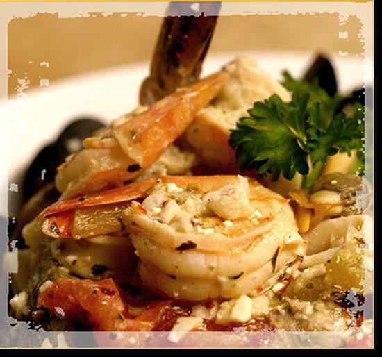Shrimp, mussels and feta in tomato sauce with parsley