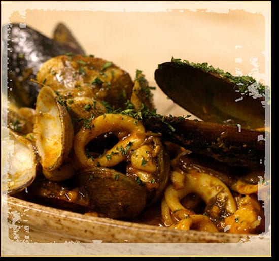 Mussels, clams and calamari in a dark sauce