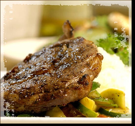Seared pork chop on vegetables