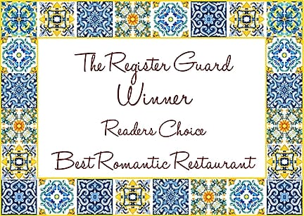 Card framed in painted tiles reading: The Register Guard Winner, Readers Choice, Best Romantic Restaurant